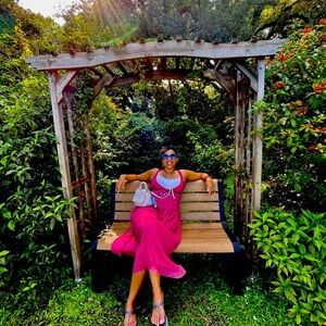 sophisticated pink dress adorned with exquisite beadwork along the chest area.